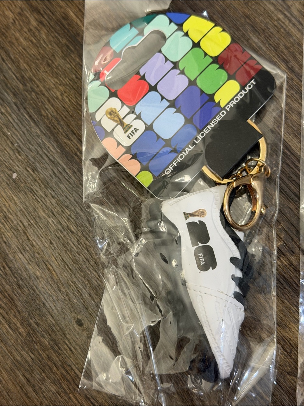 FIFA White & Black Soccer Cleat Keychain with Gold Hardware